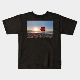 Sunrise behind the chair Kids T-Shirt